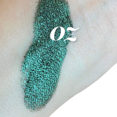 Green shimmer eyeshadow swatch on skin with white text "Oz