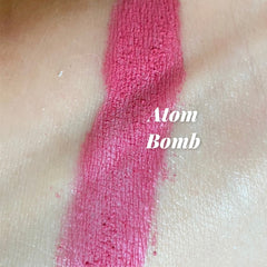 Lipstick swatch Atom Bomb, pink pigment, textured, tested on skin