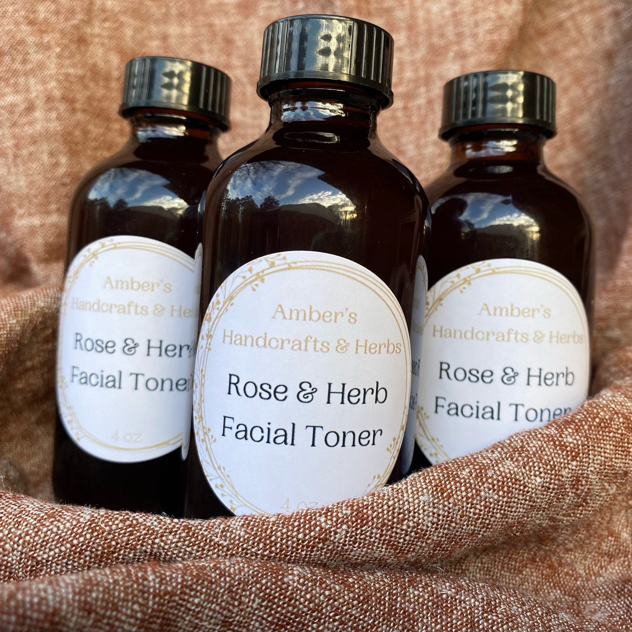 Facial toner bottles, brown glass with black caps, Ambers Handcrafts & Herbs label visible