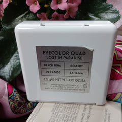 Eye shadow quad compact in white with silver label, Merle Norman brand visible