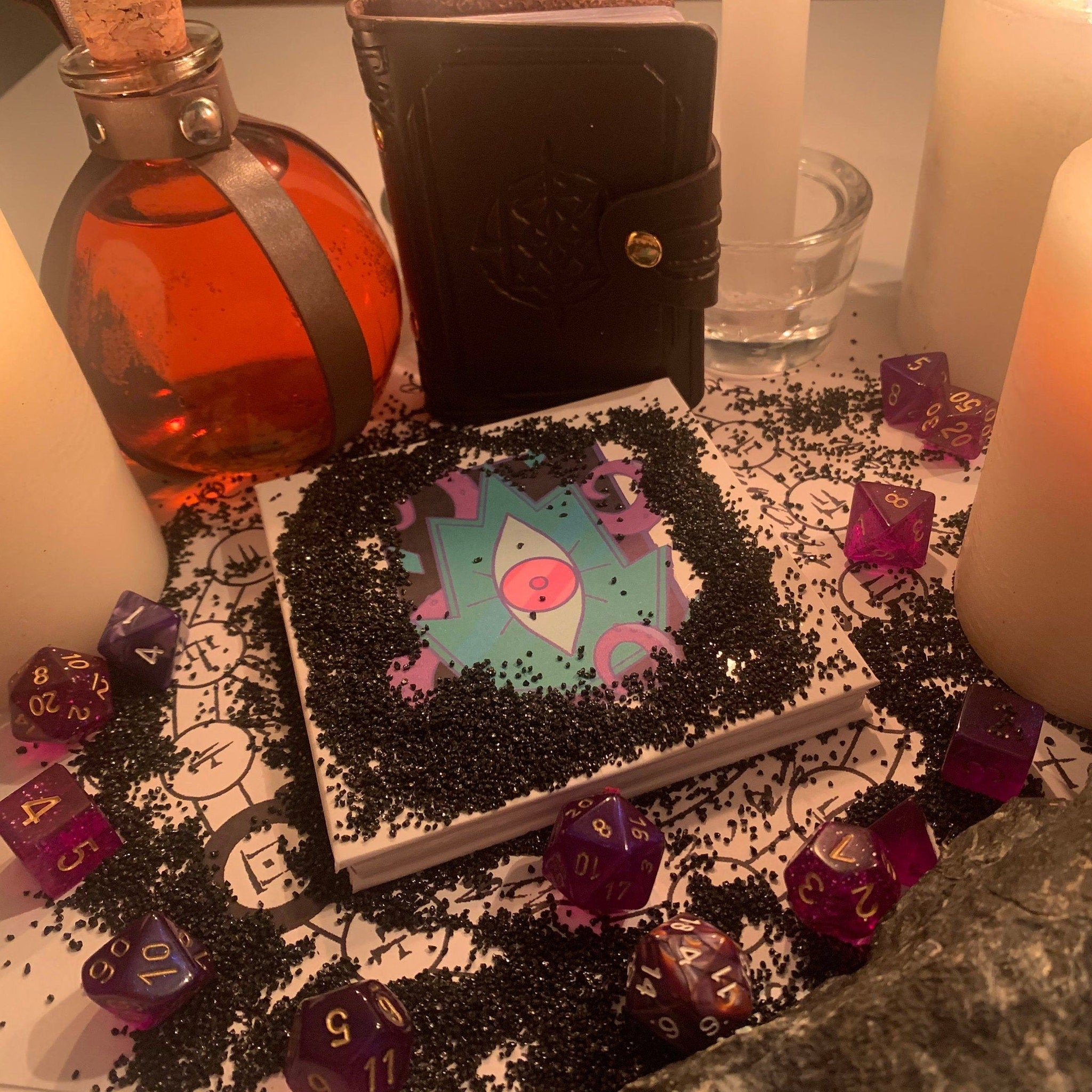 D&D Warlock Eyeshadow Palette featuring 12 matte and shimmer shades in deep purples, blues, and neutrals with gold detailing.