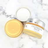 Calendula Herbal Salve, yellow salve in glass jar with silver lid, Adriatic Naturals text visible