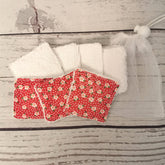 Reusable face wipes, white terry cloth and red floral print, with mesh bag for storage