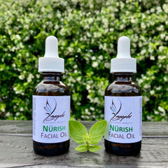 Golden-hued facial oil in sleek amber glass bottle with dropper, showcasing luxurious texture against marble backdrop