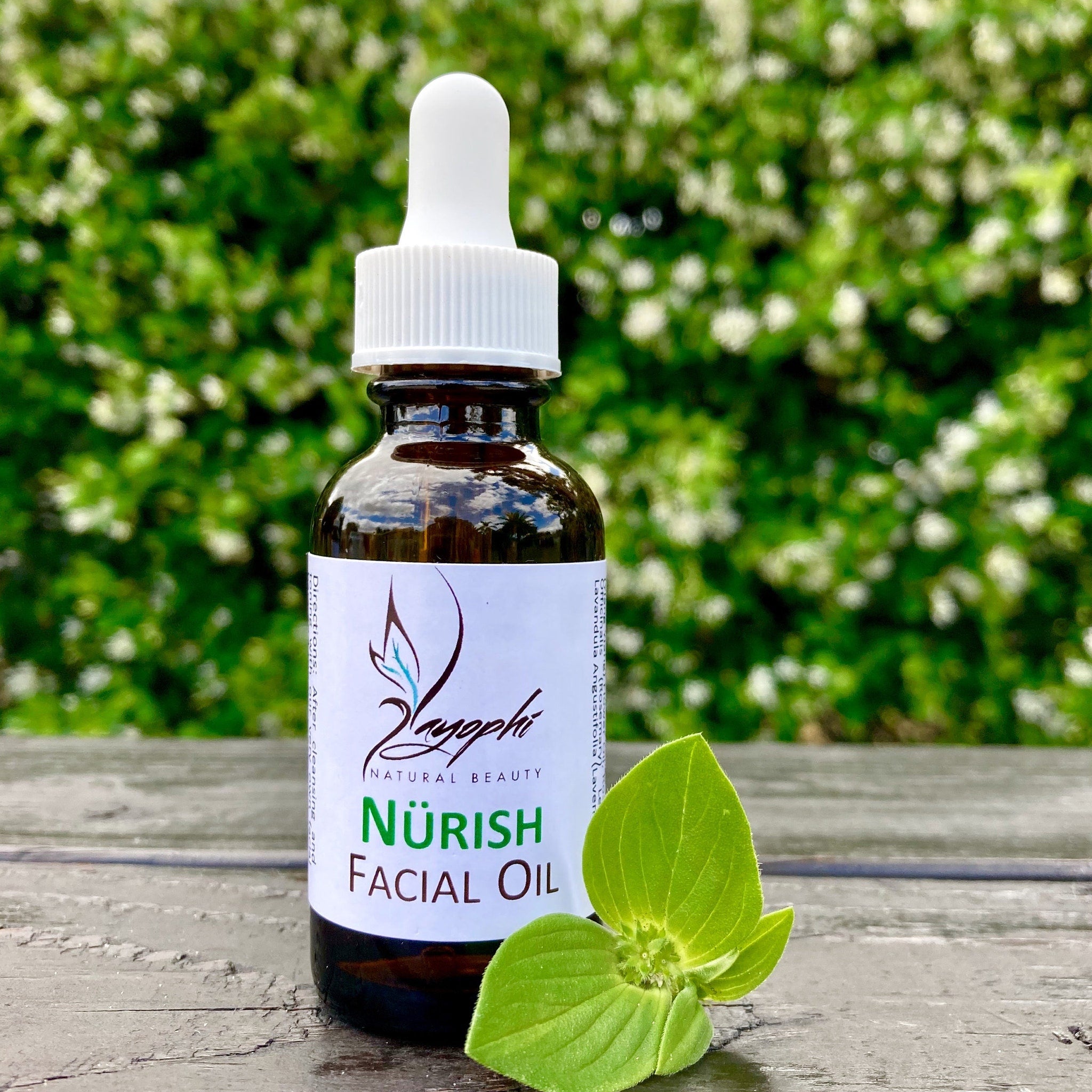 Amber glass dropper bottle of vitamin-rich facial oil with gold cap and minimalist label