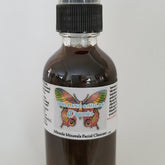 Facial cleanser spray bottle, brown liquid, black cap, Holland & Milan Organics label