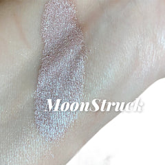 Swatched eyeshadow, iridescent shimmer, pale pink, MoonStruck text visible on skin