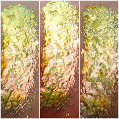 Close-up of shimmering bronze and taupe eye shadow palette with smooth, blendable powder textures