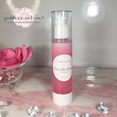 Facial cleanser bottle with pink liquid and white pump, on pink marble surface with diamonds, Goddess Retreat brand