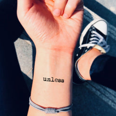 Set of four delicate temporary tattoo stickers with intricate floral designs on clean skin