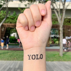 Elegant set of two skin-safe temporary tattoo stickers in minimalist black packaging with gold accents