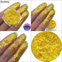 Close-up of iridescent Sunbow Chromaflake Eye Shadow Flakes shimmering with multicolor sparkles in a glass jar.