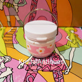Eye makeup container with white lid, pink floral band, and gold handle, Yardley brand visible