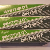 Whitfield's Ointment boxes, green and white with Bunny's brand name, stacked with text visible