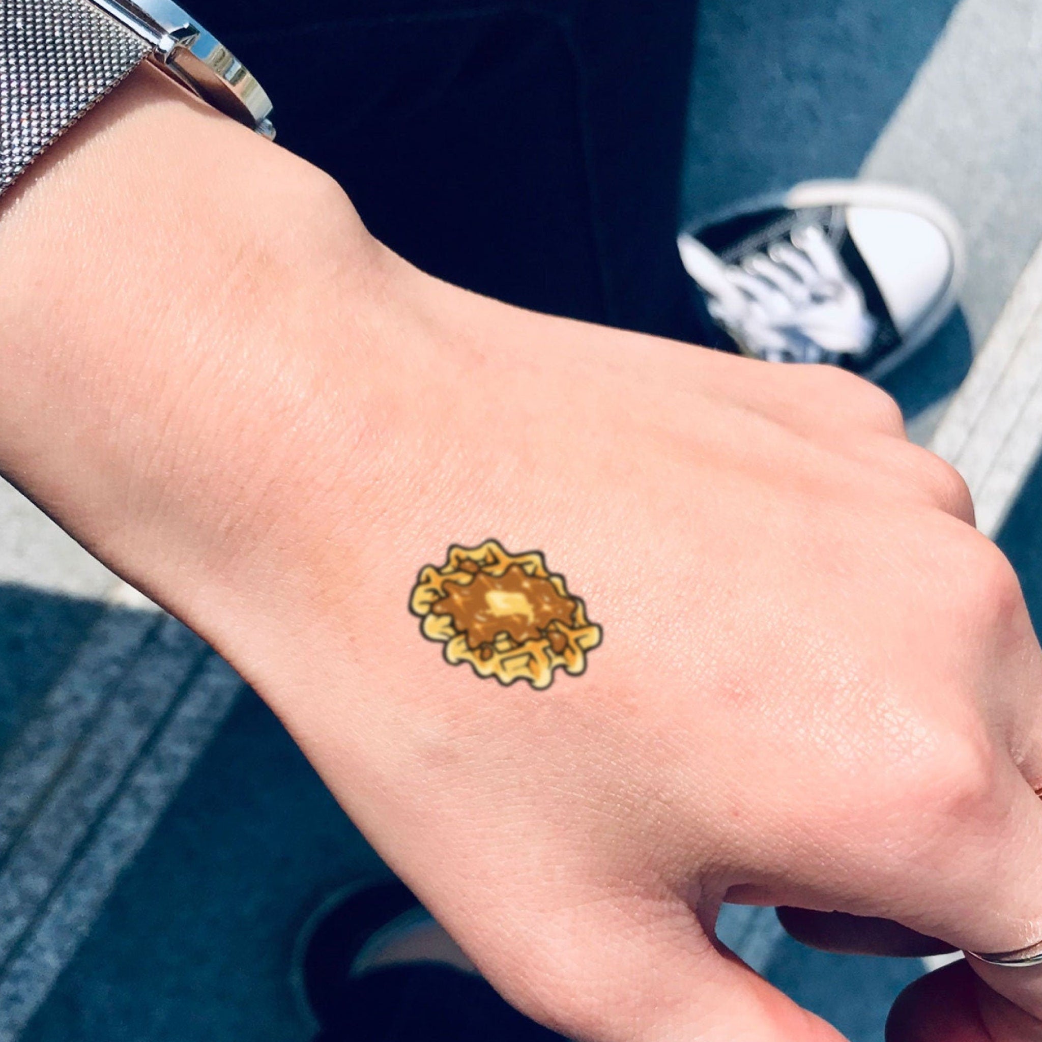 Six hypoallergenic waffle-pattern tattoo stickers in sleek black packaging for sensitive skin care routines