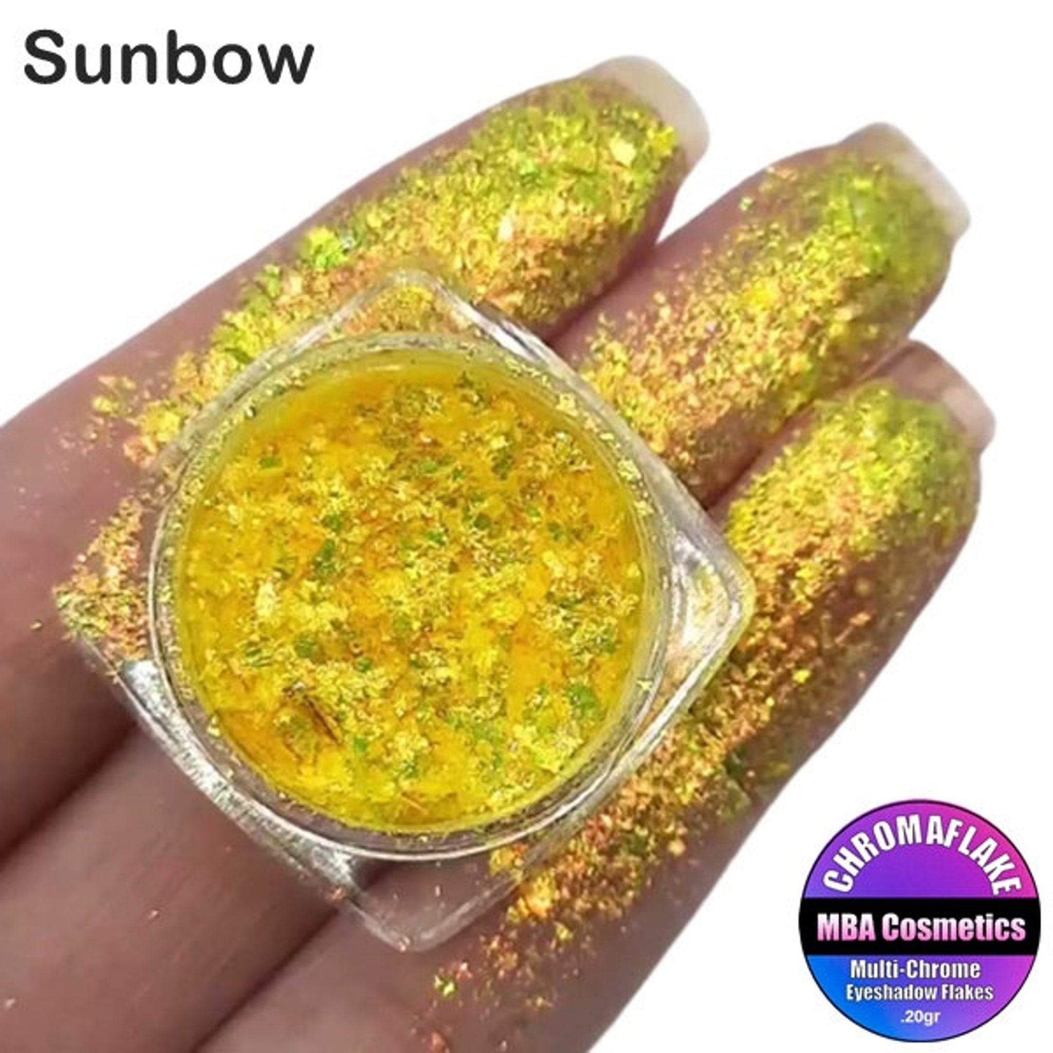 Eye shadow flakes, yellow and gold glitter, Sunbow brand name visible on fingers and in container