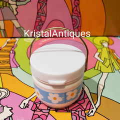 Vintage container with white and blue floral pattern, gold handle, and KristalAntiques text