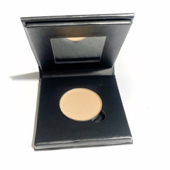Square pressed mineral eyeshadow compact in warm sunshine yellow with matte finish and paperboard packaging