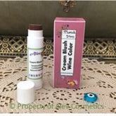 Cream blush wine color stick with white tube and pink box, Alev Cosmetics brand
