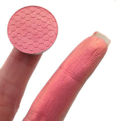 Side view of Chromadescent Multi Chrome Eyeshadow pot showcasing iridescent color shift in gradient lighting