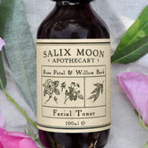Facial toner bottle, dark glass, cream label, Salix Moon Apothecary, floral illustration