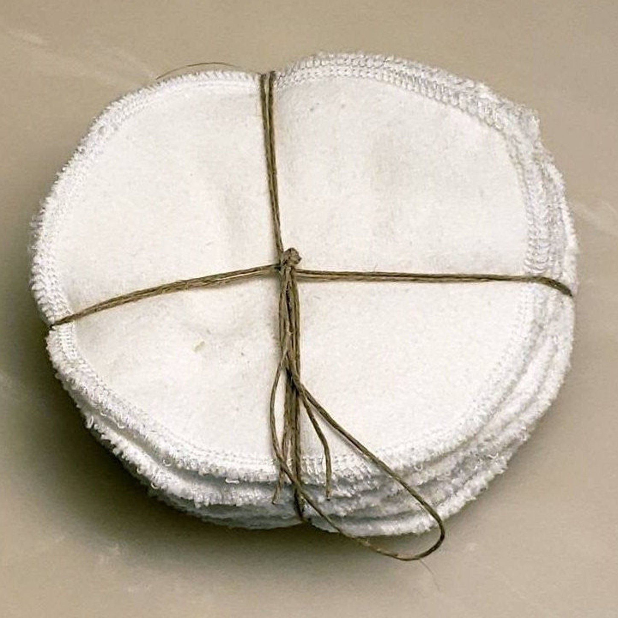 Facial rounds white flannel rounds tied with twine, stacked together