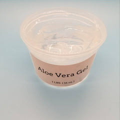 Hand applying translucent aloe vera gel to glowing cheek with fingertips