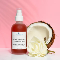 Rose face toner bottle, red liquid, white spray top, Blue Haven Holistics label, coconut and rose
