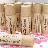 Lip Balm tubes in tan cardboard with printed labels, Pure Bubs brand, and pink heart sprinkles