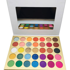 Close-up of 35 vibrant matte and shimmer eyeshadow shades in a sleek palette with mirror, showcasing high pigment colors