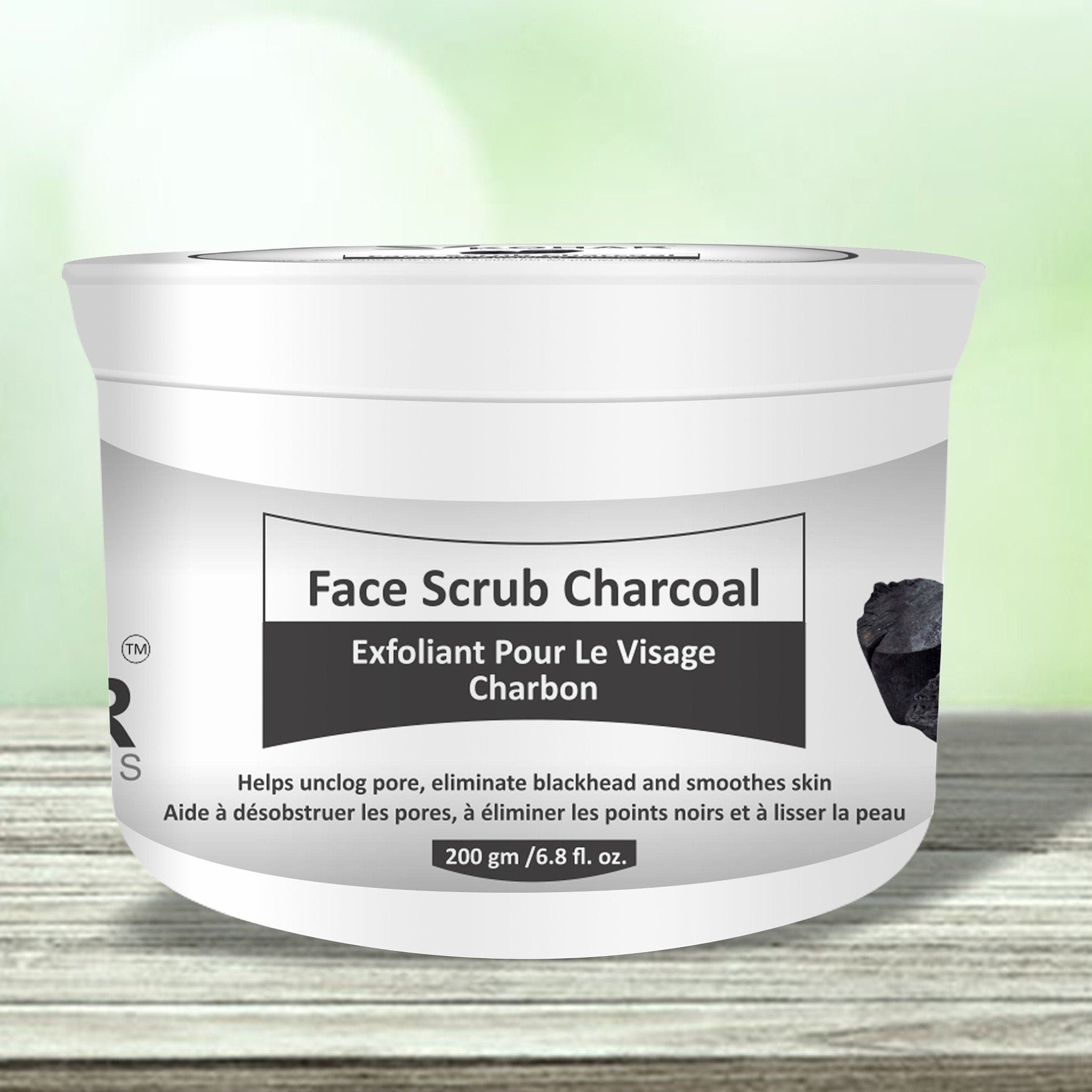 Face scrub charcoal, white plastic tub, black text label, KOHAR NATURALS branding visible on the side