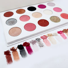 Side view of Alluring Faces Gala Glam palette showing twelve vibrant powder shadows in jewel tones with mirrored compact