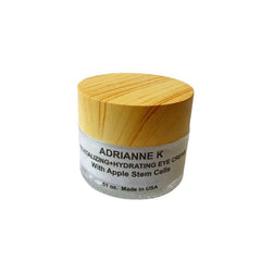 Eye cream jar with wooden lid, clear glass, and ADRIANNE K label