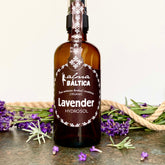 Lavender Hydrosol bottle, brown glass, white label with Alma Baltica text, purple flowers around