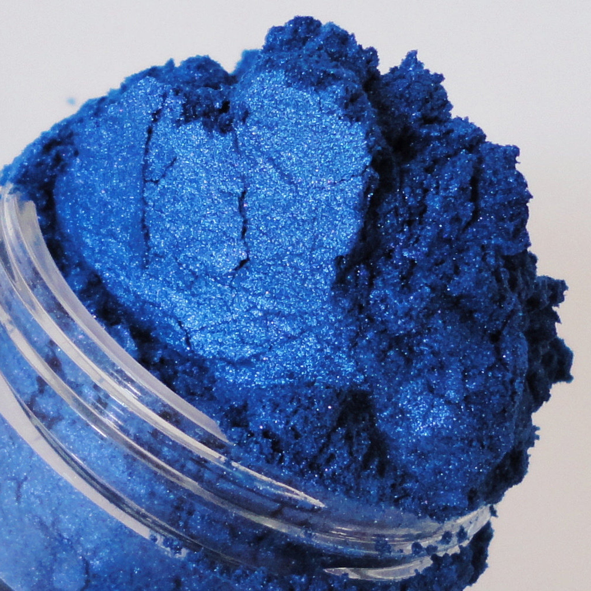 Mineral eyeshadow, deep blue shimmer powder in clear jar, Crush brand