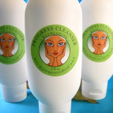 Facial Cleanser white plastic bottles with green labels and Progress Cleanser text