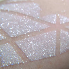 Close-up of Vegan White Wedding Icy Sparkling Eyeshadow pan with frosty white shimmer and delicate glitter particles