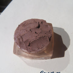 Eyeshadow powder, dark brown shimmer, loose pigment in a clear container