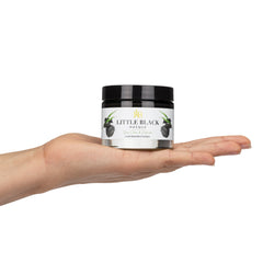 Black charcoal mask applied to nose and cheeks with smooth, even coverage for deep pore cleansing