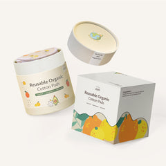 Reusable organic cotton pads in beige with fruit pattern, AVO brand packaging, and white background
