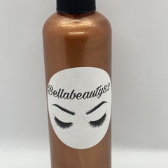 Front view of matte black makeup setting spray bottle with gold nozzle and minimalist label