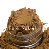Eye shadow powder, brown matte color, in a clear jar, "Buck Naked" text visible