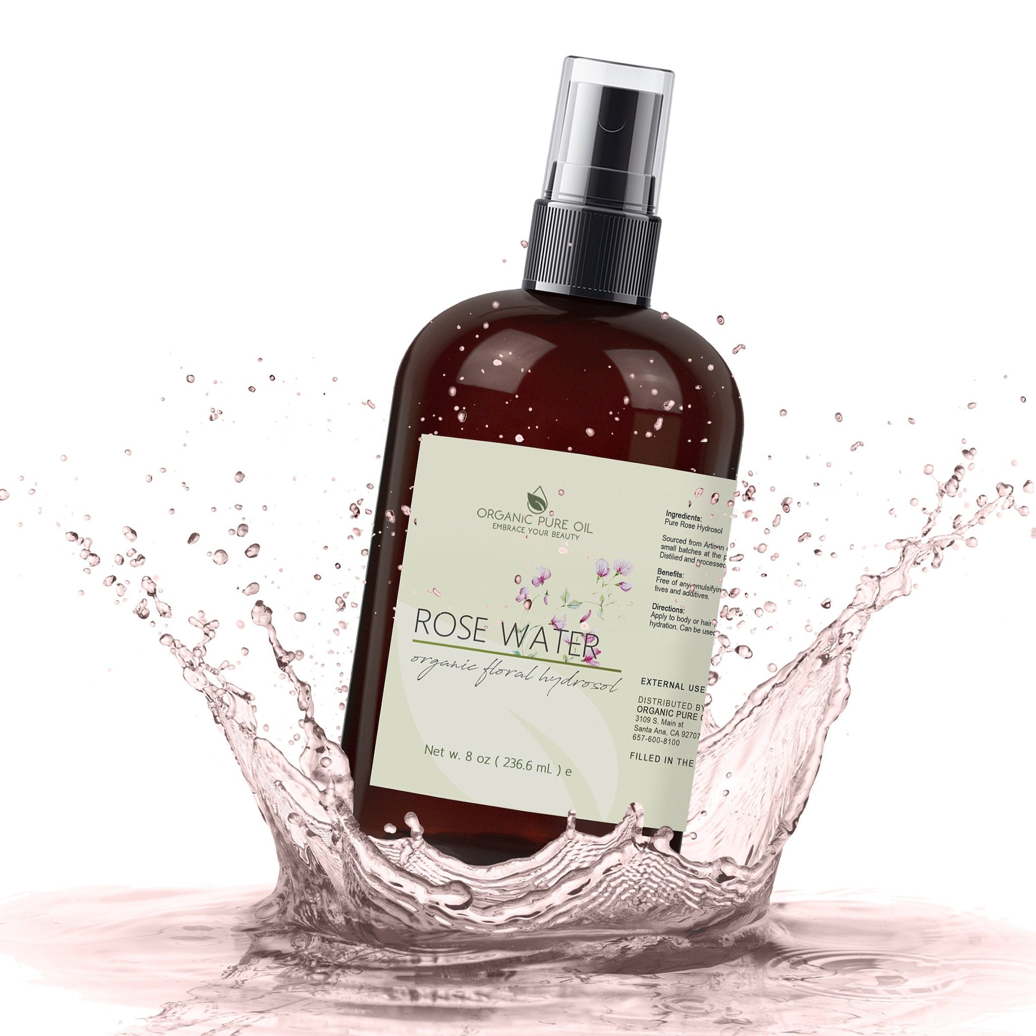 Rose water spray bottle, brown glass bottle, black cap, with water splash around it