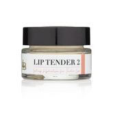 Lip balm jar with black lid, clear glass, and white label with text "LIP TENDER 2