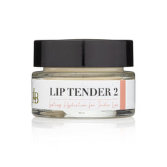 Lip balm jar with black lid, clear glass, and white label with text "LIP TENDER 2