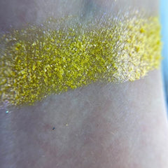 Close-up of Xray Eyeshadow Palette showing vibrant matte and shimmer shades in jewel tones