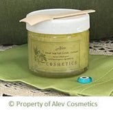 Dead Sea Salt Scrub jar, yellow scrub, white lid, Alev Cosmetics label visible