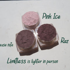 Close-up of three loose mineral eyeshadow pigments in matte neutral shades with vegan and cruelty-free labeling