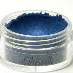 Eyeshadow pot with blue powder, clear plastic jar, and "Etherealle" text on the side