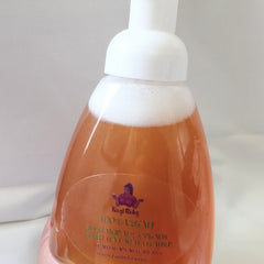 Foam soap bottle with white cap, orange liquid, and Kazi Rokz label